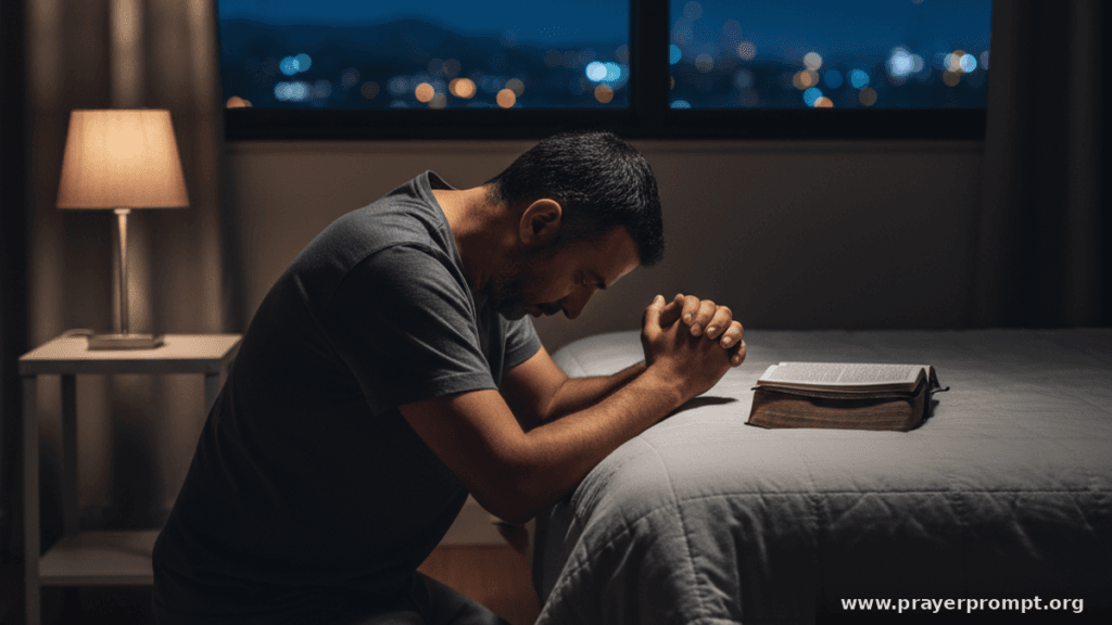 Man kneeling beside his bed in prayer at night