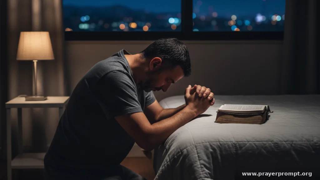 Man kneeling beside his bed in prayer at night